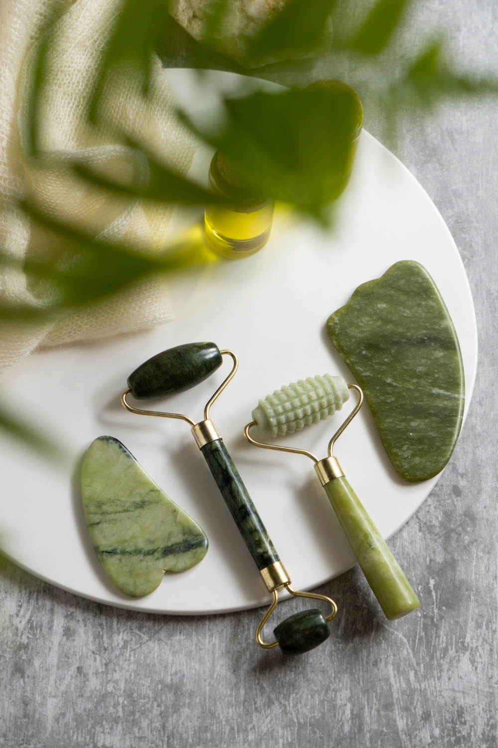 Gua Sha tools and jade rollers, essential beauty aids designed to elevate your self-care routine naturally