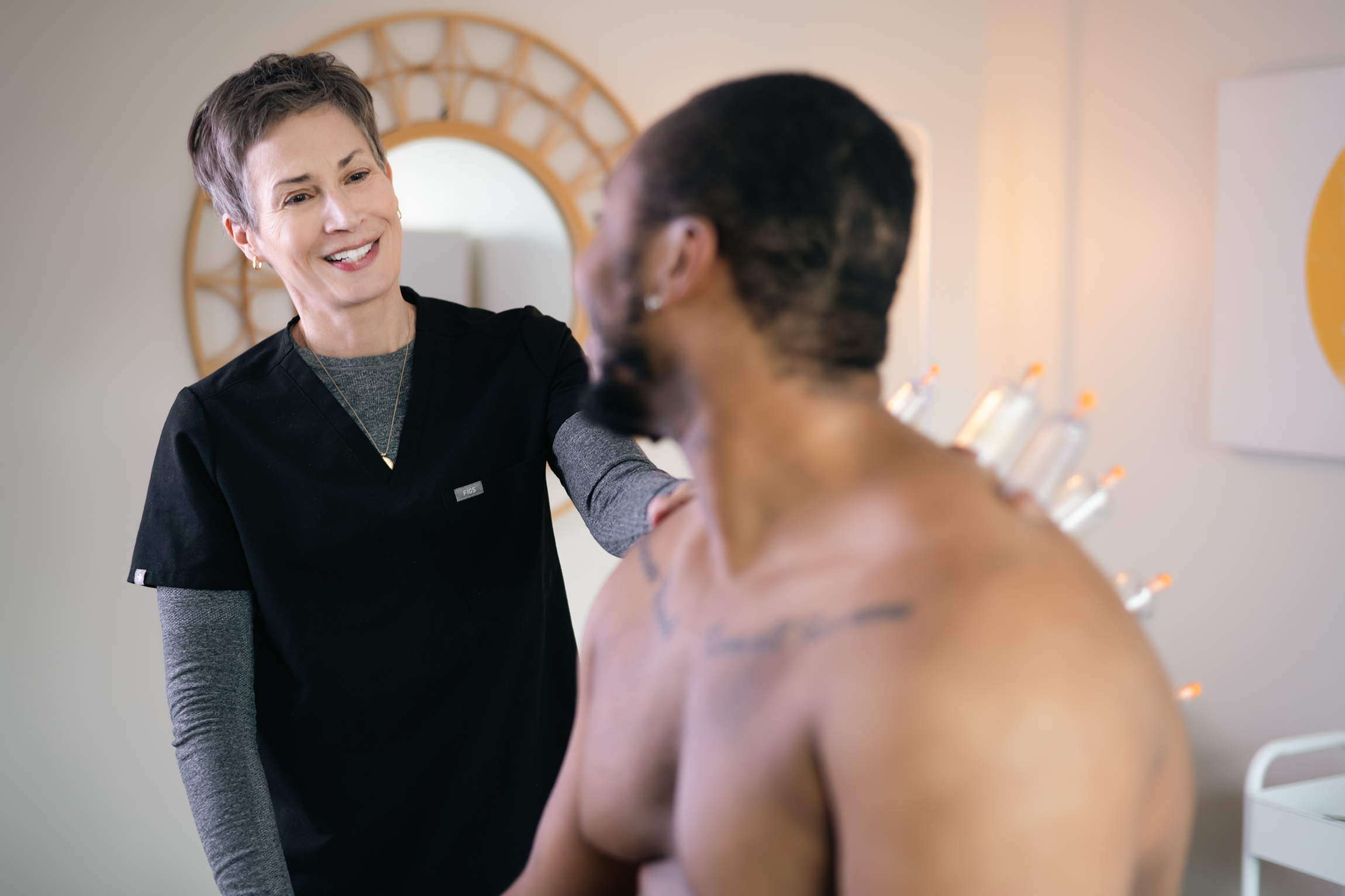 Smiling during a Sports Acupuncture and cupping therapy session